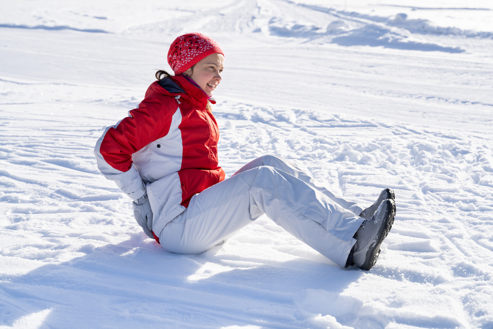 Girl falling on snow