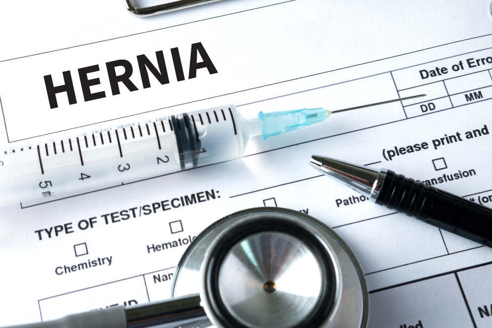 Hernia medical report with syringe and stethoscope