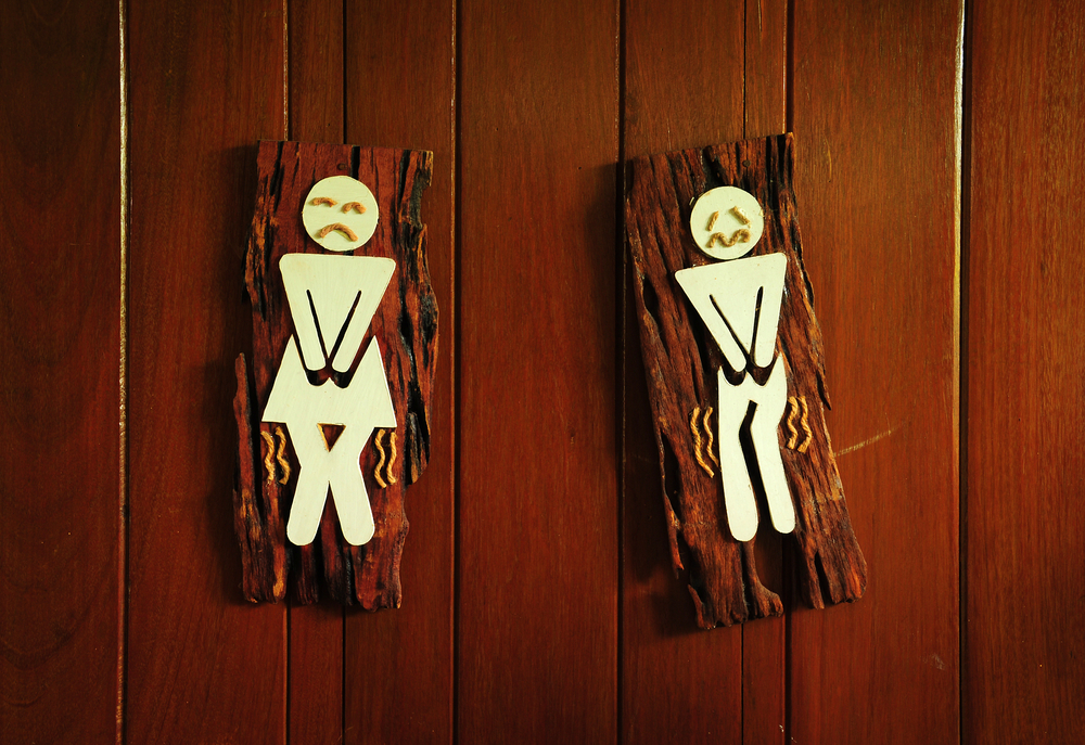 Male and female bathroom signs designed to look uncomfortable, as if they need to pee