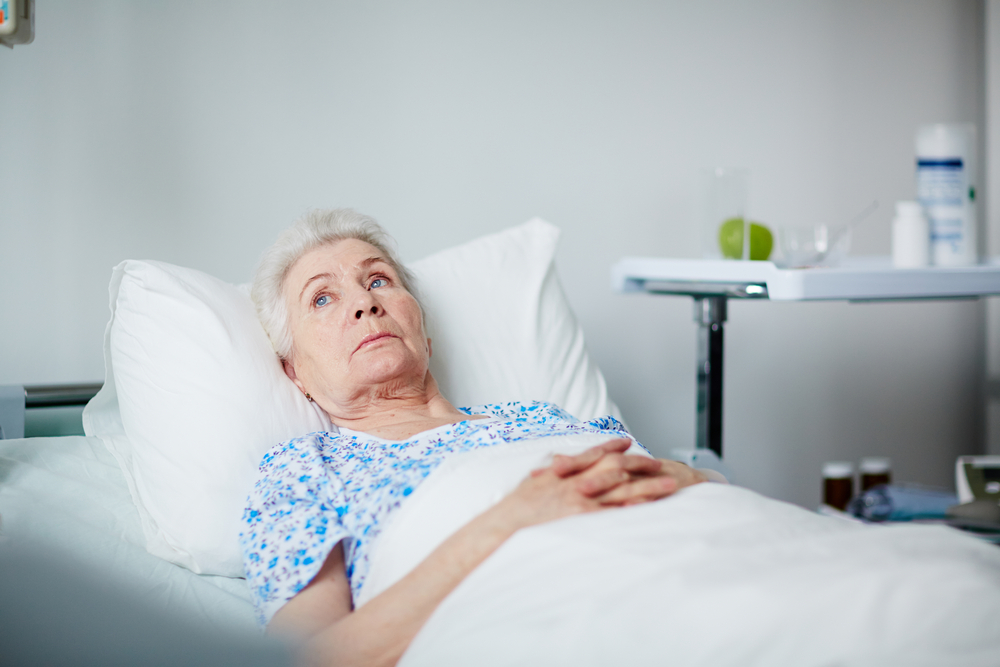 Senior woman lying in bed